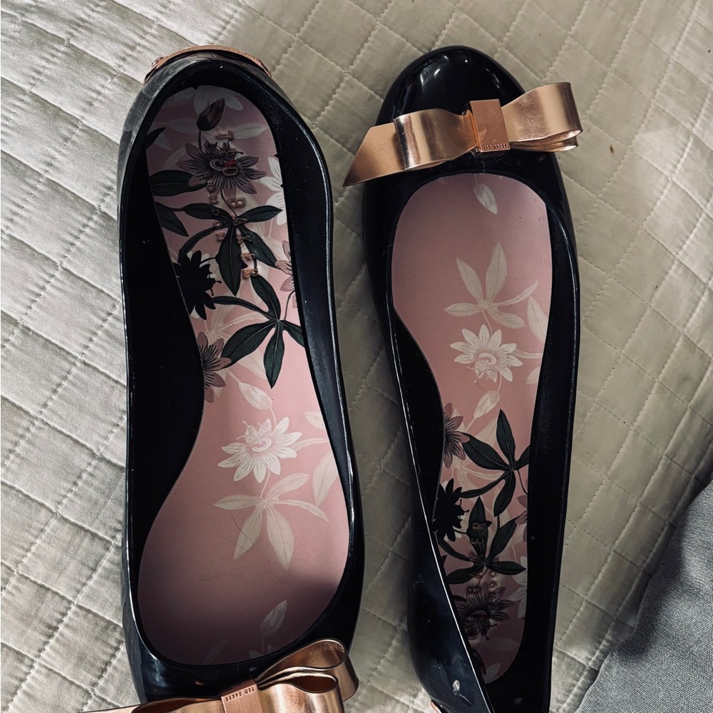 Ted Baker Black Rubber Flats with Gold Bow
